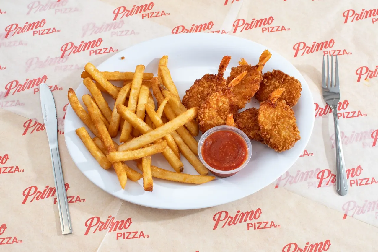Fries and fried shrimp with cocktail sauce
